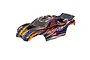 Traxxas 1/10 Rustler clipless painted body shell in orange, black, and blue racing graphics.