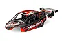 A pre-painted red and black Traxxas Funco Pro Scale sand car body shell with a rear wing and detailed interior, isolated on a white background.