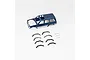 A blue painted RC car body shell for a Toyota Land Cruiser LC80, shown with separate black plastic wheel arch flares and small mounting screws on a white background.
