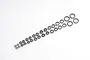 A collection of various sized metal ball bearings arranged in two rows on a plain white background.