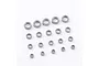 A collection of various sized metal ball bearings arranged on a plain white background.