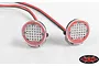 Two round RC4WD ARB Intensity LED off-road lights with red bezels and wiring, set against a plain white background.