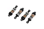Four Maverick RC shock absorbers with orange aluminium bodies, black plastic ends, and white coil springs arranged diagonally on a white background.