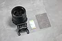 Pandora RC steering wheel accessory for Sanwa transmitters, including a wheel-shaped grip, mounting bracket, adhesive strip, and brake disc decal sheet.