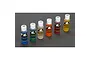 A set of six TLR shock oil bottles in various viscosities ranging from 20 to 45 weight, arranged in a line on a dark grey surface.