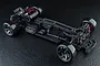 Top-down view of an assembled MST RMX 4 Classic 1/10 scale RWD RC drift car chassis on a black textured background.
