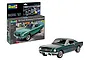 Revell 1/24 scale 1965 Ford Mustang 2+2 Fastback model kit box and a fully assembled green model car on a white background.