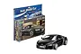 Revell 1/24 scale Audi R8 plastic model car kit in its original packaging with a finished black model car displayed in front.