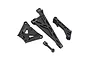 A set of black plastic RC car chassis braces and suspension components on a white background.