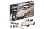Revell 1/32 scale VW Beetle plastic model starter kit box, including the assembled white model car, glue, paint pots, and a paintbrush.