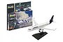 Revell 1/144 scale Airbus A320neo Lufthansa model kit, including packaging with paints, glue, and brush, alongside the assembled and painted model on a stand.