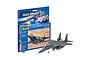 Revell 1/144 scale F-15E Strike Eagle plastic model kit in blister packaging with a fully assembled and painted model aircraft displayed in front.