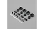 A collection of black plastic shock parts, metal pivot balls, and white plastic washers for an RC car, arranged on a grey background.