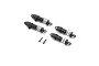 A set of four assembled black RC shock absorbers with silver springs and two small mounting screws on a white background.