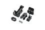 A set of black plastic RC car body and cage mounting components including a spring, arranged on a white background.