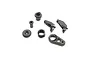 A set of black plastic RC servo saver components including a spring, servo horn, and various mounting bushings on a white background.