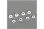 A set of eight small white plastic shock guides and bushings for TLR RC vehicles arranged on a grey surface.