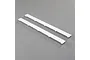 Two white foam leading edge slats for an E-Flite Timber X RC plane, shown on a grey background.
