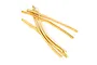 A small pile of tan-coloured rubber bands used for securing RC plane wings.