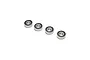Four Losi 6x15x5mm ball bearings with black rubber seals arranged in a diagonal line against a white background.