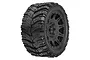 Pro-Line Masher X HP belted monster truck tire mounted on a black Raid wheel, viewed from a three-quarter angle.