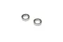 Two small metal ball bearings shown on a plain white background.