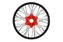 Pro-Line 1/4 scale Promoto-MX rear motorcycle wheel with a black rim, silver spokes, and a red anodized aluminum hub against a white background.