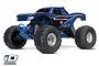 A studio shot of the blue Traxxas Bigfoot 1/10 scale RC monster truck with Firestone branding on a white background.