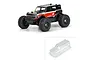 A painted 1/10 scale RC Ford Bronco on a chassis, with an inset showing the unpainted clear polycarbonate body shell.