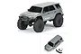 A grey Pro-Line 1/24 scale Toyota 4Runner TRD Pro RC body shell shown mounted on a chassis and as a separate body with accessories.