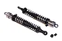 Two grey aluminium RC shock absorbers with black springs and plastic ends, shown on a white background.