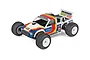 A studio shot of a Team Associated RC10T 1/10 scale electric RC truck with a white, blue, yellow, and red vintage-style livery.
