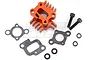 An orange anodized aluminium intake manifold with heat sink fins, accompanied by two gaskets, two bolts, and four small washers on a white background.