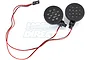 A set of two round Rovan Baja LED headlights with black housings and red and black wiring with a connector.
