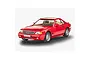 A studio shot of a red 1/24 scale model Mercedes-Benz 300 SL-24 coupe on a white background.