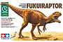 Tamiya 1/35 scale Fukuiraptor dinosaur model kit box art showing a detailed illustration of a brown theropod dinosaur in a desert landscape.