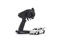 A white Kyosho Mini-Z Porsche 911 GT3 RS RC car next to a black Syncro KT-531P transmitter on a white background.