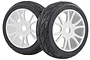 Two black rubber RC on-road tires mounted on white multi-spoke plastic rims against a white background.