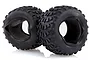 Two black rubber RC off-road tires with blocky tread patterns and grey foam inserts inside, set against a white background.