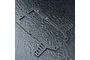 Two black FRP upper deck chassis plates for an RC car, featuring mounting holes and slots, displayed on a textured dark surface.