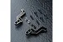 A pair of black MST aluminium rear shock braces with included screws, nuts, and spacers on a dark textured surface.