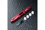 MST red anodized aluminium lower suspension arm mount with white plastic inserts and a black metal plate on a dark textured surface.