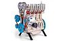 A detailed metal model kit of a four-cylinder engine with gold-toned engine block, blue pulleys, and red drive belts, mounted on a black stand.