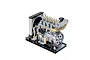 A detailed 1/10 scale metal model of a four-cylinder diesel engine by Teching, featuring a radiator, cooling fan, and mounting base.