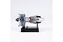 A Teching DM122 mini turbofan engine model kit displayed on a black stand against a white background.