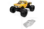 A composite image showing a fully assembled yellow RC monster truck and an unpainted, clear polycarbonate body shell for the Pro-Line Brunt truck.