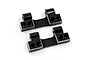 Two black aluminium RC rear lower arm mounts from Yeah Racing, shown from an angled perspective on a white background.