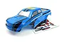 A blue and black pre-painted RC truck body shell for the BlackZon Slyder MT Turbo, shown with an included decal sheet on a white background.