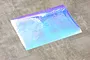 A rectangular sheet of iridescent blue Aurora window sticker material for RC car bodies, shown against a grey background.