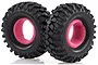 Two black rubber RC crawler tyres with aggressive tread patterns and bright pink foam inserts, isolated against a white background.